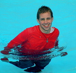 pool boy with anorak in pool