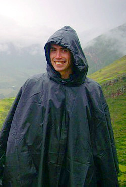 black poncho in the rain